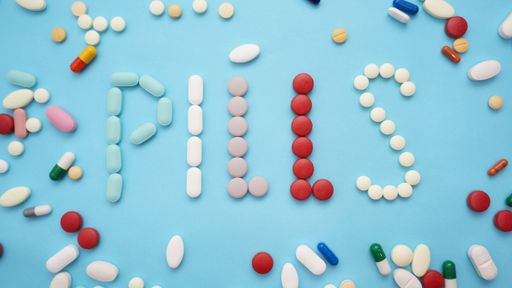 A word pills with different pills in blue background