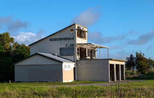 The Horowhenua boating club surrounded by a garden under the sunlight in Levin, New Zealand
