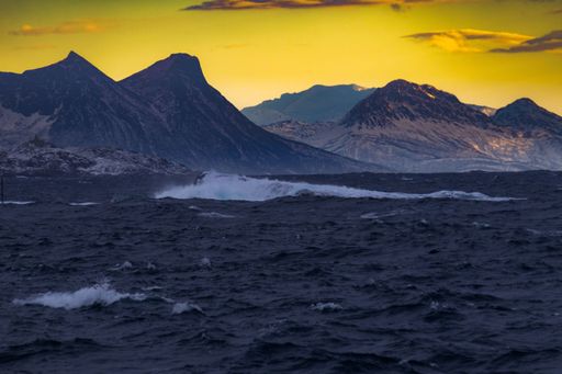 A mesmerizing view of a golden sunset over mountains