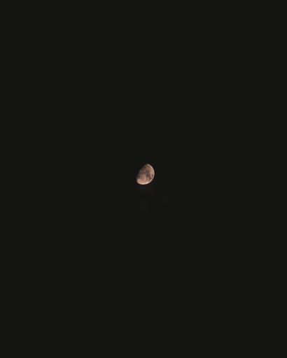 A view of the beautiful midnight moon on a black sky background