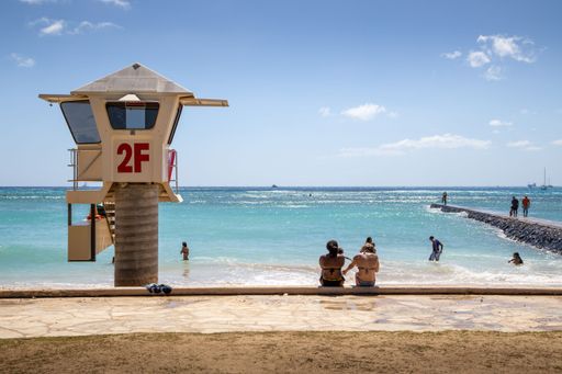 Lifeguard tower 2F looks over a part of Waikiki Beach, a popular tourist destination in Honolulu, Hawaii.