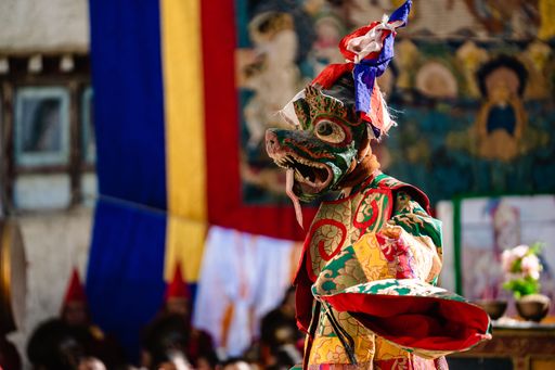 The Tibetan Buddhist dancer in traditional demon spirit ghost clothing doing the ritual dance at the Tiji Festival in Nepal