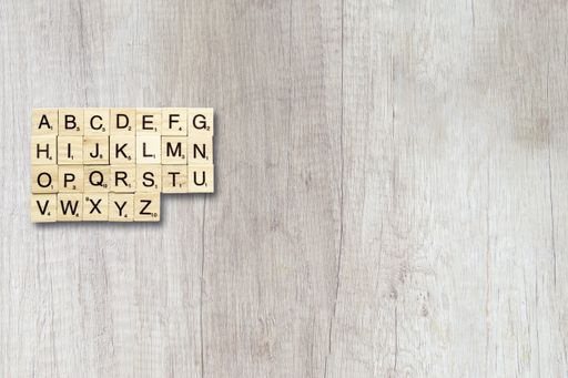 An overhead shot of board game cubes on a wooden surface