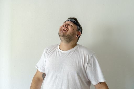 A cool guy with a black bandana on his head isolated on a white background