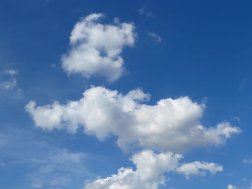 A beautiful shot of a blue sky with fluffy white clouds for wallpapers