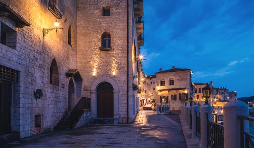 The empty quiet streets and stone buildings with illuminated lanterns in a small tow in China