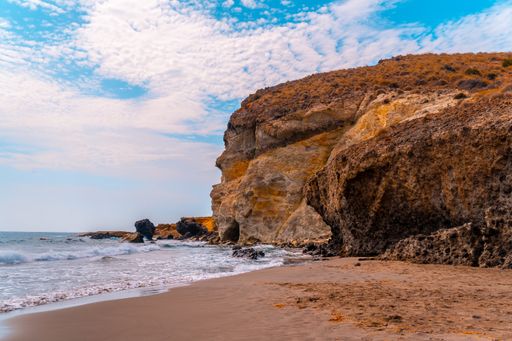 A view of the rocks on the beach in Almeria, located in Andalusia, Spain during daylight