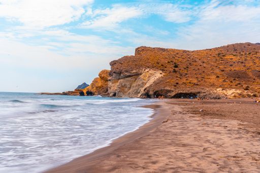 A view of the rocks on the beach in Almeria, located in Andalusia, Spain during daylight