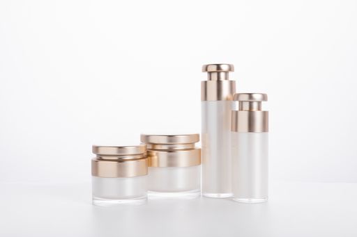 A set of skincare bottles and containers isolated on a white background