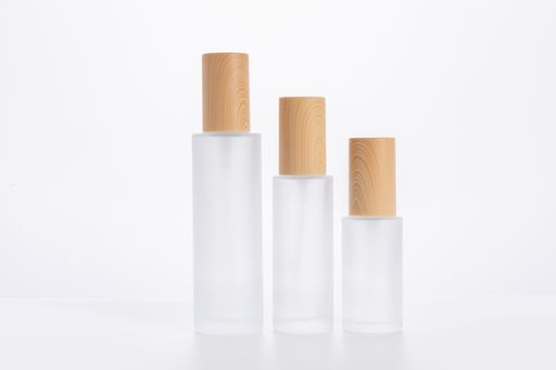 The three different sized skincare bottles isolated on a white background