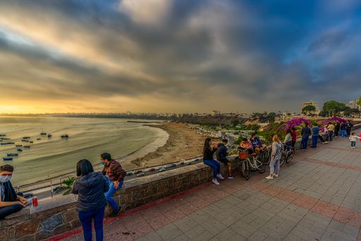 People go out into the streets at sunset with their masks after the social isolation experienced in Lima