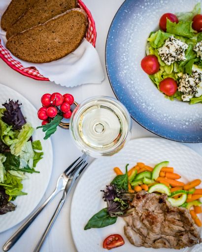 An overhead shot of various healthy meals on a table at a restaurant