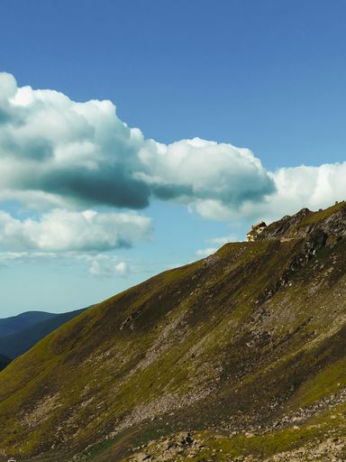 A mesmerizing view of a beautiful mountainous landscape under a cloudy sky