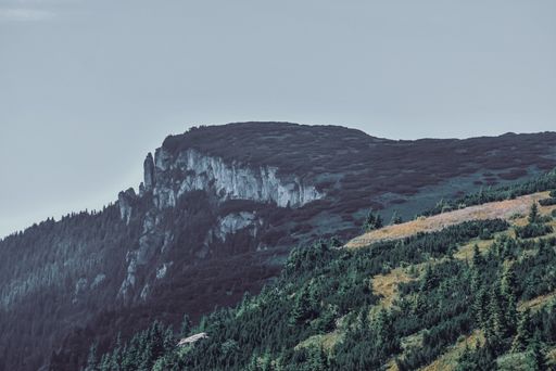 A mesmerizing view of a beautiful mountainous landscape under a cloudy sky