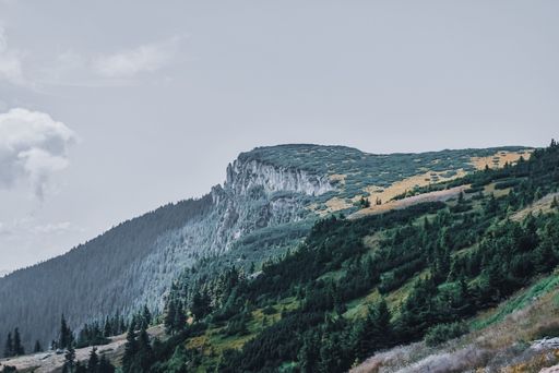 A mesmerizing view of a beautiful mountainous landscape under a cloudy sky
