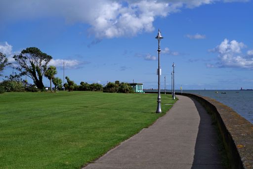 Clontarf Promenade Park situated along Dublin Bay on sunny summer day. Clontarf is a coastal suburb of Dublin, Ireland, popular to live and visit.