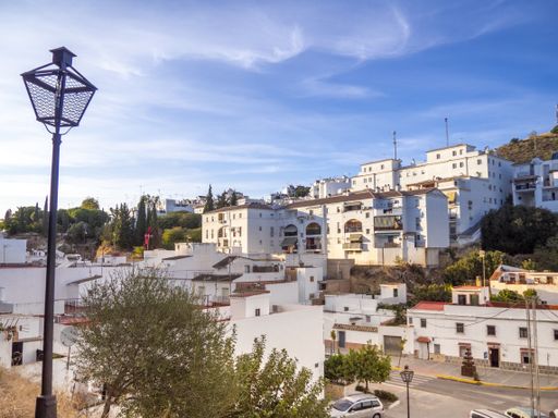 The beautiful white buildings on the hill in the town of Arcos de la Frontera in Spain
