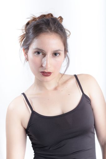 A young woman portrait with red lips in studio
