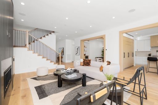 A modern living space designed to serve as both a kitchen and family room