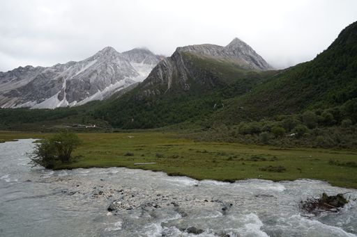 The cloud-capped mountains in the Daocheng Yading National Park, Sichuan, China.