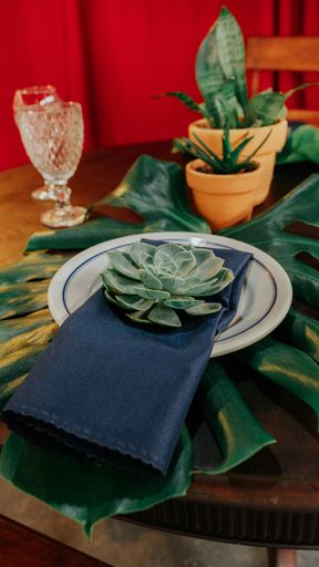 A vertical shot of a table setting using natural elements for a  rustic party