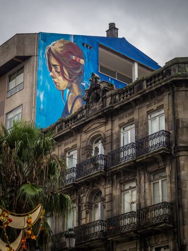 Street art painting in old building in Vigo
