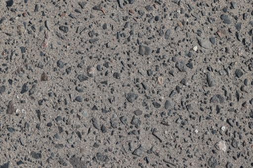 A closeup shot of a textured gray floor with small stones