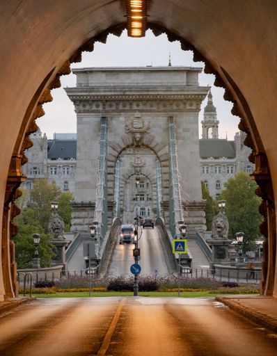 A vertical shot of the Szechenyi Chain Bridge from inside a tunnel in Budapest, Hungary