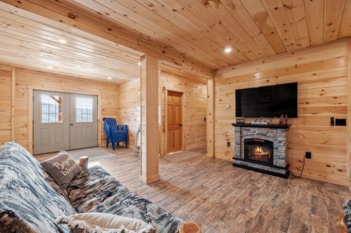 A living room interior of log cabin in mountains