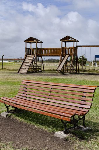 A vertical shot of a square bench instead of wooden games