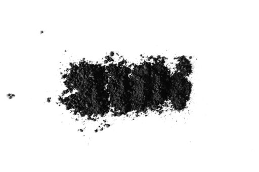 A closeup shot of black powder on a white background