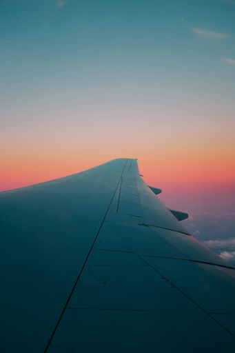 A vertical shot of an airplane wing captured from the airplane window