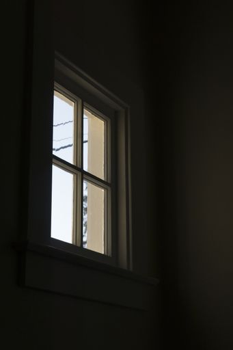 A vertical shot of the light coming inside through a window