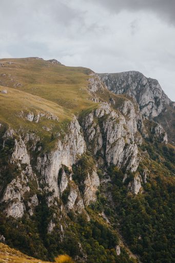 A high angle shot of rocky mountains in Vlasic,  Bosnia  on a gloomy day