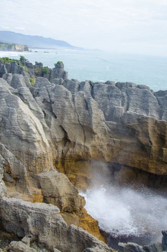 A vertical shot of the Pancake Rocks in New Zealand