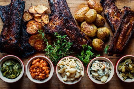A high angle closeup shot of delicious stakes with side dishes and sauces - perfect for a food blog