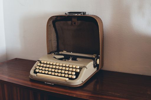 A vintage grey typing machine