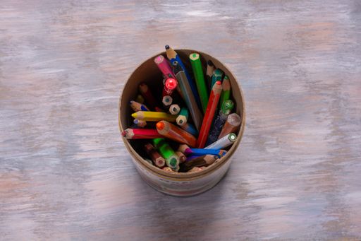 A top view of colored pencils on a container