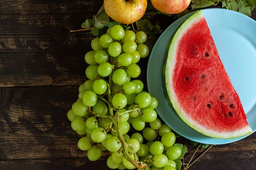 A top view of the sliced watermelon on the plate with other fruits