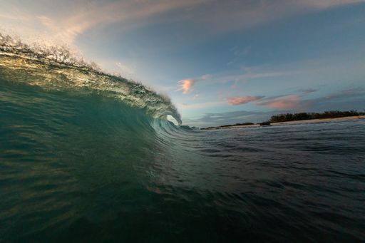 A beautiful scenery of big waves splashing towards the ocean shore in Bonaire, Caribbean