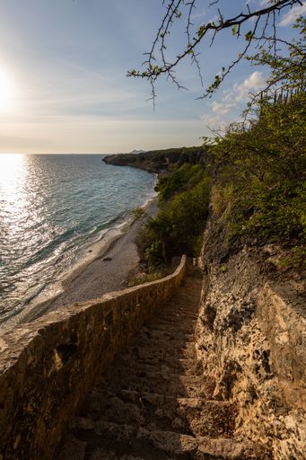 A vertical shot of the sun rising over the ocean in Bonaire, Caribbean