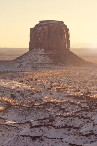 A vertical shot of a stone formation in Monument Valley in San Juan County, Utah, United States