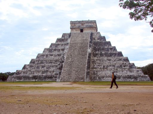 Chichen Itza, Yucatan / Mexico - January 4 2010: Caucasian Woman Tourist Walks in Front of Aztec Pyramid