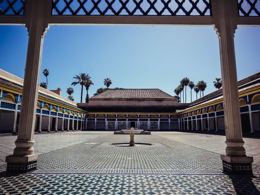 An exterior of the white building under the sun light in Morocco.