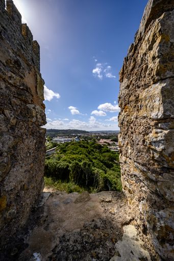 A vertical shot of castle wall in Obidos