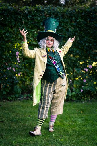 Cosplay of the mad hatter from Alice in Wonderland. Beautiful portrait of a pretty young woman with makeup