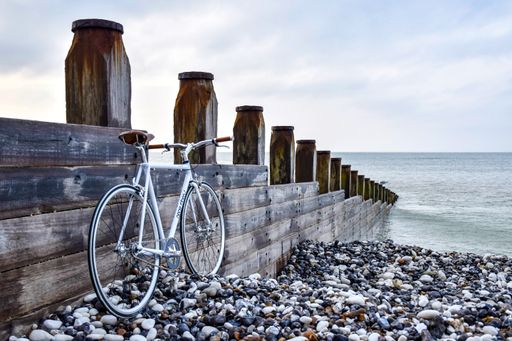 My steel frame bicycle propped up at the beach. The bicycle was made for me after I designed a logo for the customer.