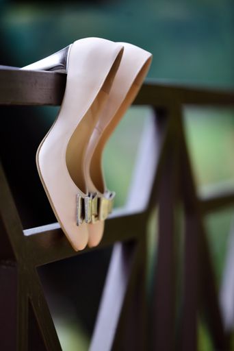 A vertical shot of beige heels