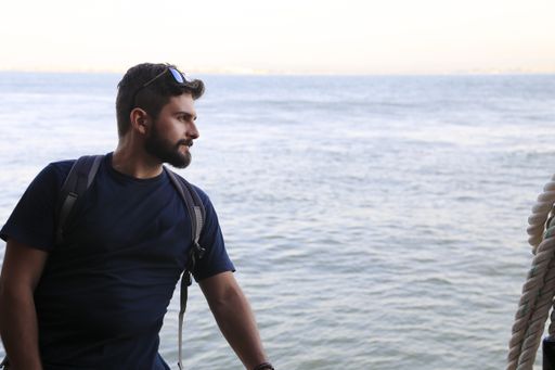 A  shot of an attractive man near Tagus river, Lisbon, Portugal