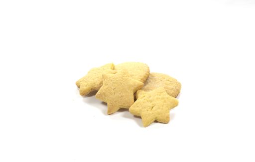 A closeup shot of butter baked biscuits in the shape of star and heart on a white background